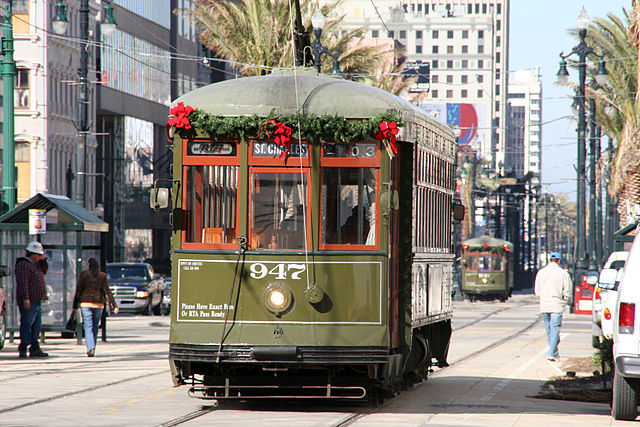 At night Canal Street features twinkling holiday lights. By day the streetcars are adorned with holiday decorations. (Photo courtesy Robert Kaufmann)