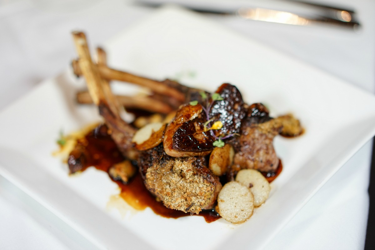 Enjoy Coriander-Crusted Lamb Chops with Seared Foie Gras, Spiced Chestnuts and Port Wine Reduction as part of Criollo Restaurant's Reveillon dinner. (Photo: Paul Broussard)