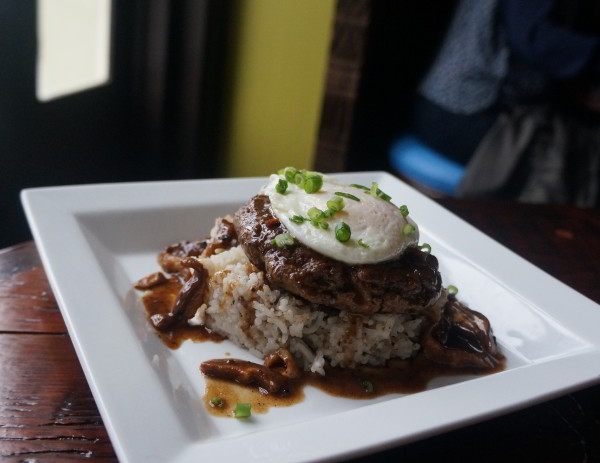 The Loco Moco features an 8 ounce beef patty, shiitake mushrooms, coconut rice, and a fried egg. Find it at Latitude 29 bar and restaurant, inside Bienville House Hotel in the French Quarter of New Orleans.